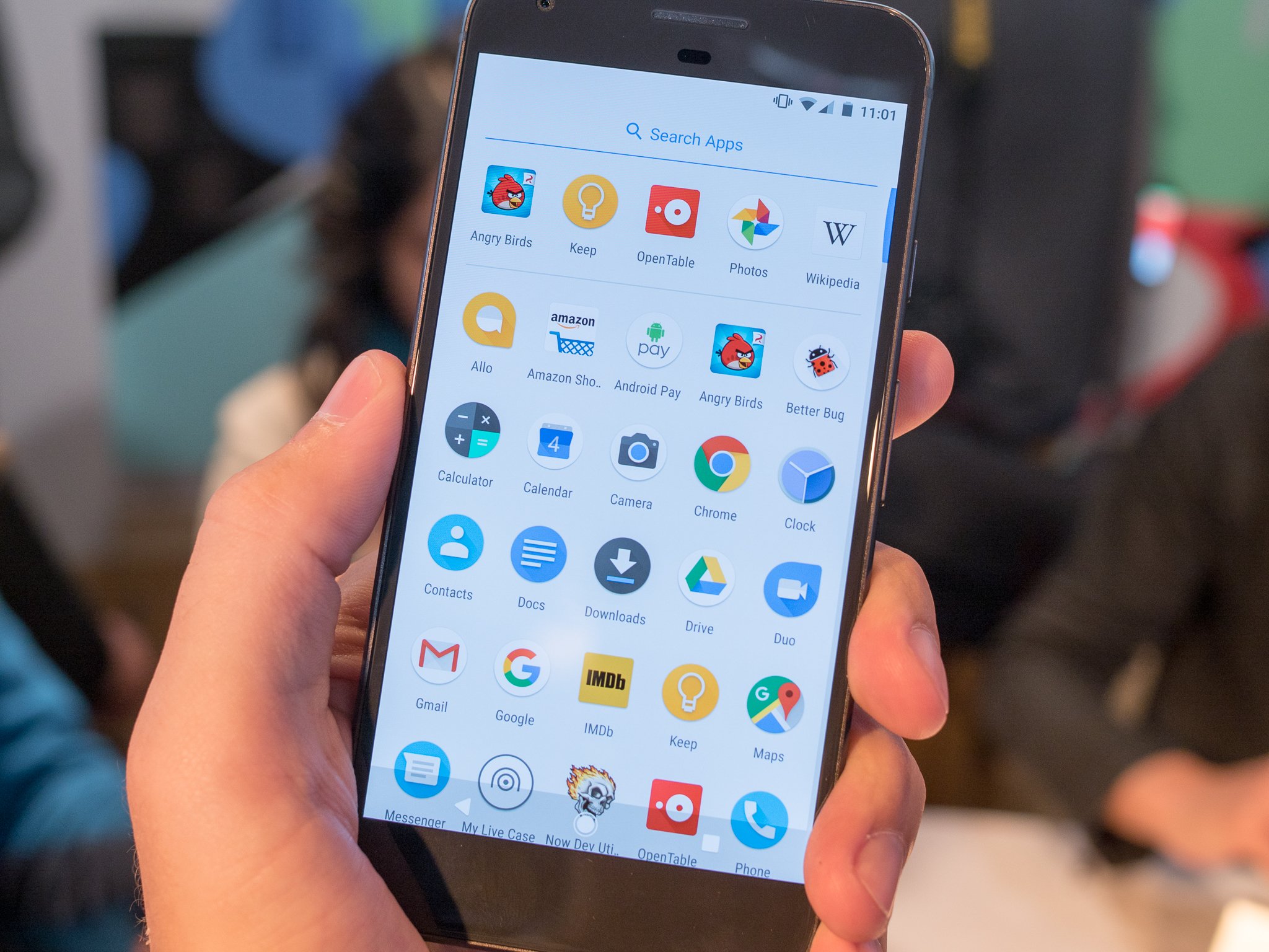 Person holding a Google Pixel with the app drawer open
