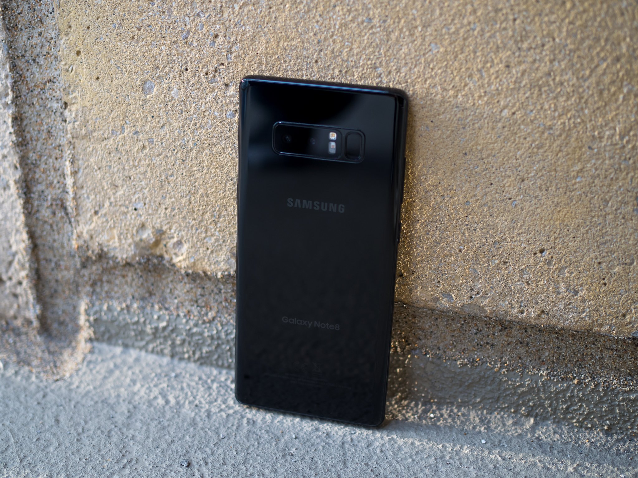 galaxy-note-8-black-back-angle-on-cement