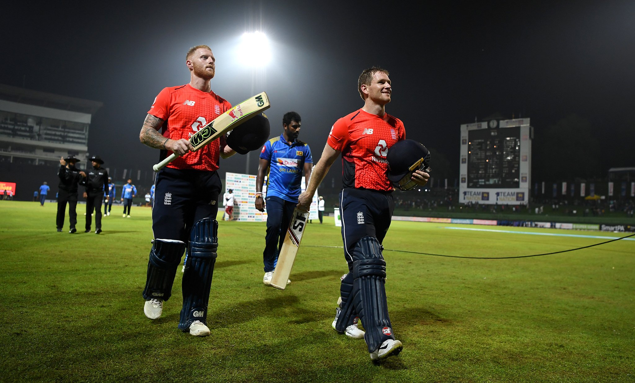 KANDY, SRI LANKA - OCTOBER 17:  England captain Eoin Morgan and Ben Stokes leave the field after winning the 3rd One Day International match between Sri Lanka and England at Pallekele Cricket Stadium 