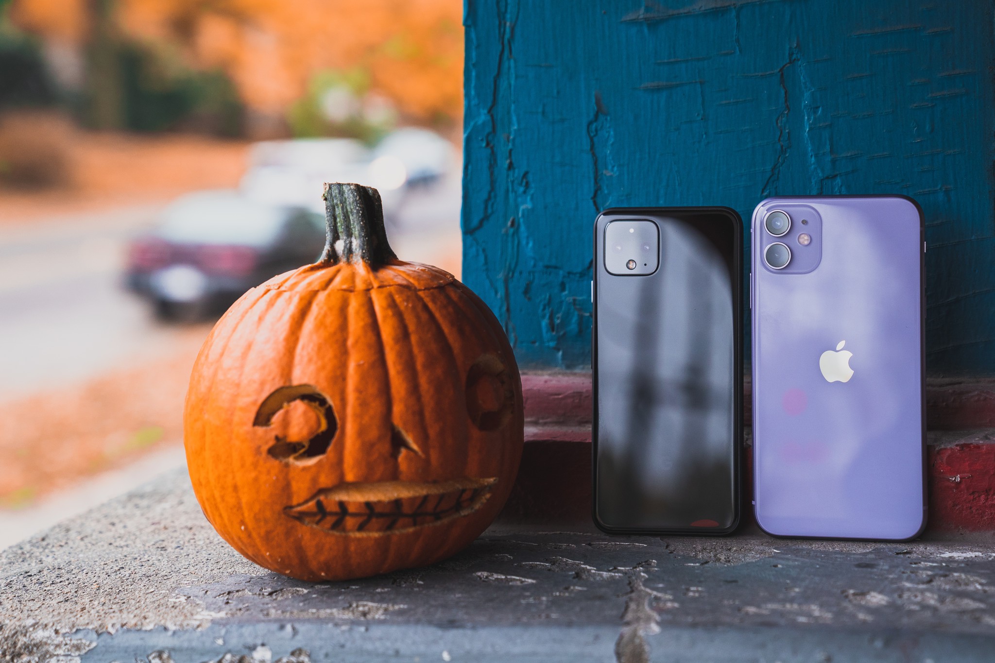 PIxel 4 and iPhone 11 next to a jack-o-lantern