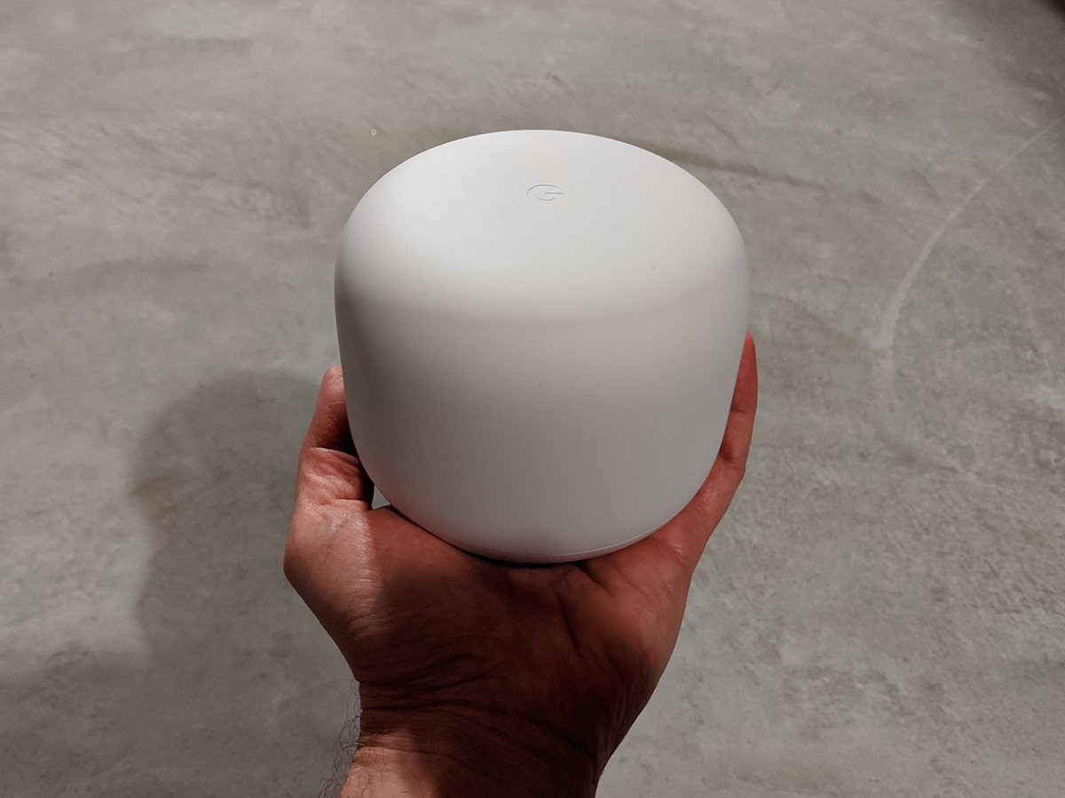 Holding a Nest Wifi Router