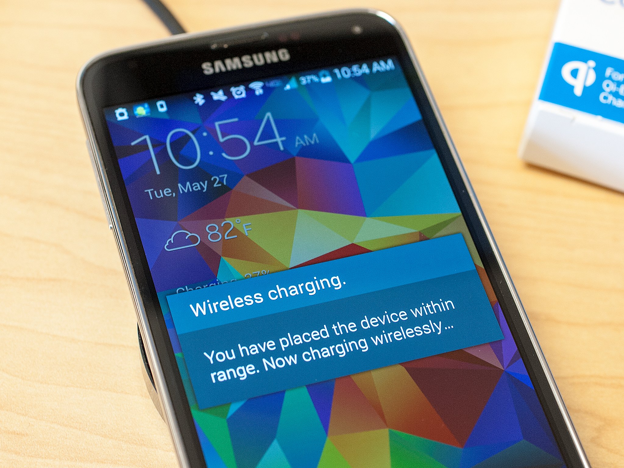 How do you charge a Samsung device wirelessly?