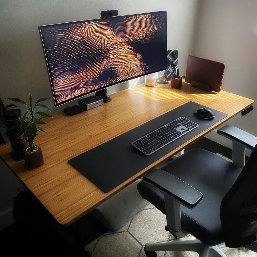 Autonomous SmartDesk2 bamboo desk work from home office with computer, keyboard, mouse, and office chair